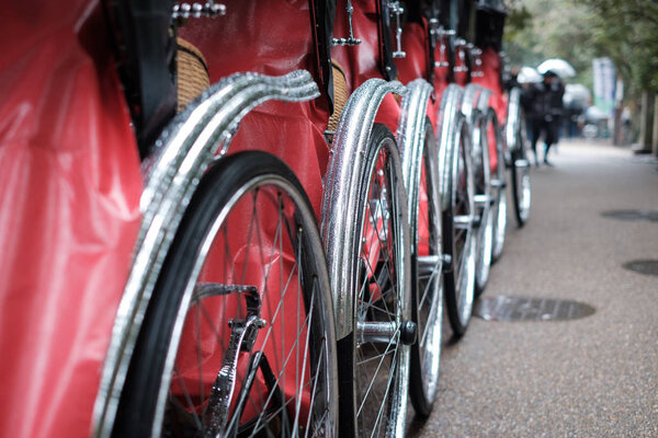 Japanese traditional rickshaw focused on wheel