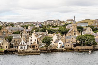 historic village of Stromness on Orkney mainland, Scotland, Uk. Seaside view of this fisherman town at Hoy sound  clipart