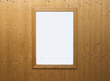 Tahta desenli bir duvarda asılı dikdörtgen bir çerçeve, maket. Çerçeveli ahşap duvar, tasarım için doğal zemin