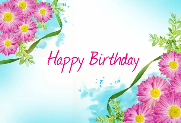 Happy Birthday with a background of pink gerbera flowers and blue watercolor. Greeting card