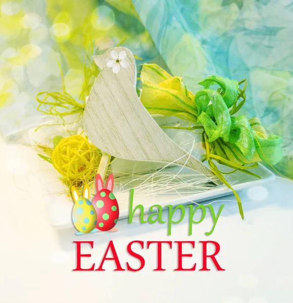 Happy Easter greeting card with wooden bird, nest and eggs