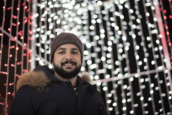 adult bearded man looking at camera in christmas portrait