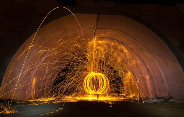 Fire spark from steel wool in tunnel