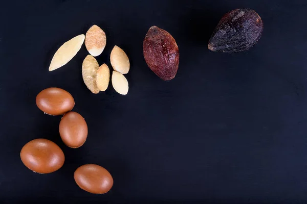 Close up of Argan fruits on a chalkboard — Stock Photo, Image