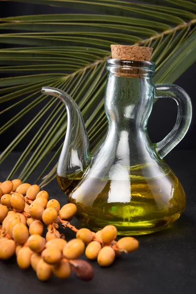 Bottle of Palm Oil and palm fruits — Stock Photo, Image