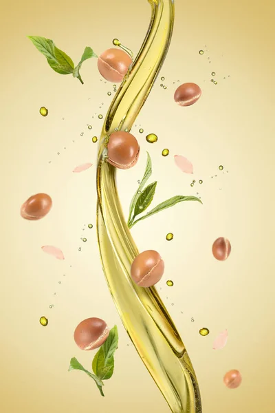 Spash of oil with argan — Stock Photo, Image