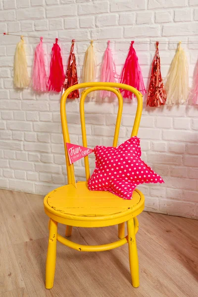 Photo zone with decorations for the birthday celebration for the girl. Idea for decorating pink style first year birthday party for little girl. Stylish props One year photo shoot for booth. Children\'s photo Studio for kids