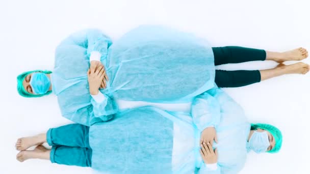 Two Women Protective Medical Suits Face Masks Young Girls Lie — Stock Video