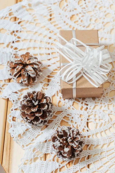 Square Craft Gifts Boxes Snow Covered Cones Table Light Brown — Stock Photo, Image