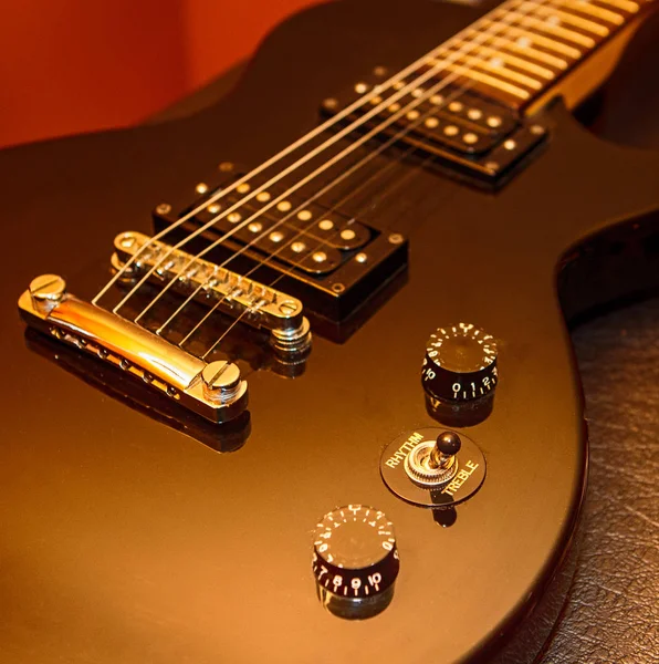 Electric Guitar / Close up of a black Les Paul style guitar