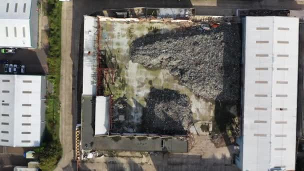 Aerial view of a warehouse destroyed by fire and filled with waste junk, Margate, Kent, UK — стокове відео