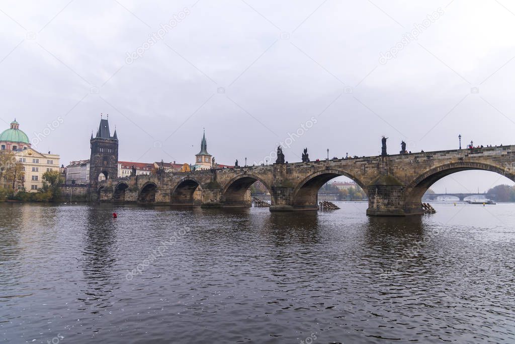 Skyline view with historic Charles Bridge or Karluv Most and Vltava river, Prague, Czech Republic