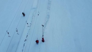 Aerial view of downhill skiing at local ski resort. Ski lift. Russia, Leningrdaskaya oblast, village Korobitsyno near Saint Petersburg.