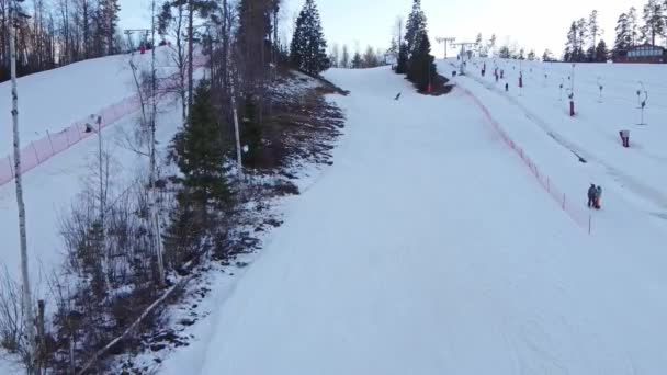 Aerial view of downhill skiing at local ski resort. Ski lift. Russia, Leningrdaskaya oblast, village Korobitsyno near Saint Petersburg. — Stock video