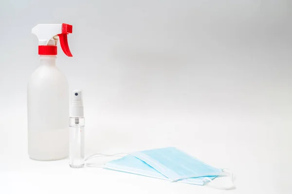 Protective face mask and sanitizer gel dispenser on white background, against Novel coronavirus (2019-nCoV) or Wuhan coronavirus and Influenza. Antiseptic, Hygiene and Healthcare concept