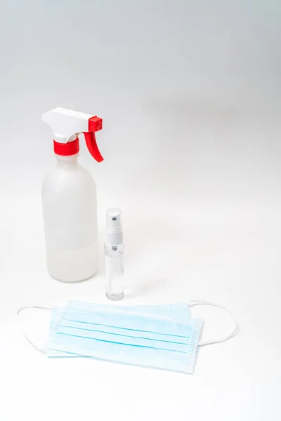 Protective face mask and sanitizer gel dispenser on white background, against Novel coronavirus (2019-nCoV) or Wuhan coronavirus and Influenza. Antiseptic, Hygiene and Healthcare concept