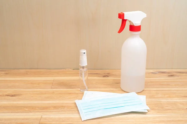 Protective face mask and sanitizer gel dispenser on white background, against Novel coronavirus (2019-nCoV) or Wuhan coronavirus and Influenza. Antiseptic, Hygiene and Healthcare concept