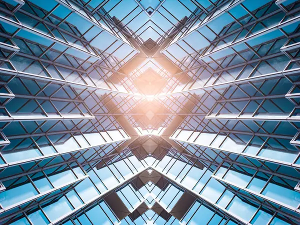 stock image underside panoramic and perspective view to steel blue glass high rise building skyscrapers, business concept of successful industrial architecture