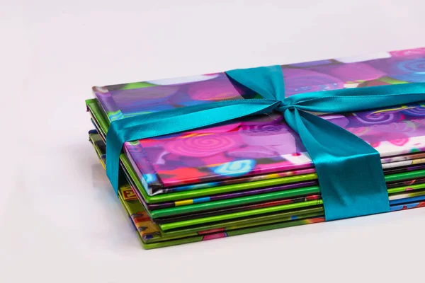 Colored books in a stack. Children's books in a gift ribbon. Bright colorful little books for children. — Stock Photo, Image