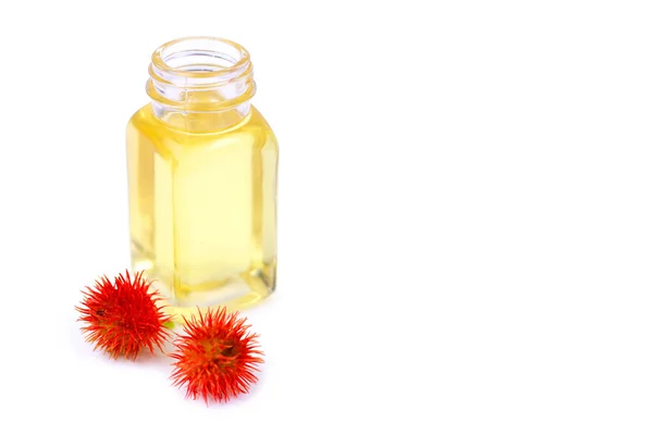 Aceite de ricino en botella de vidrio sobre fondo blanco — Foto de Stock