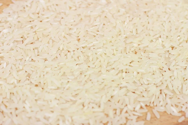 Heap of raw rice — Stock Photo, Image