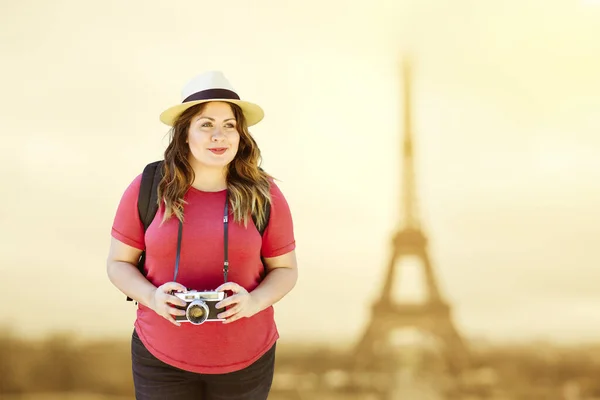 Pretty woman tourist walks in Paris with her camera - Travel - Vacation - Daytime - Happy