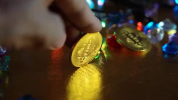 Bitcoin Moneda Oro Mano Sobre Fondo Luces Multicolores — Vídeos de Stock