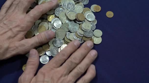 Hands Collecting Coins Blue Background Greed Concept Saving Money — Stock Video