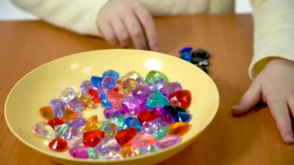 Year Old Child Counts Colored Pebbles — Stock Video