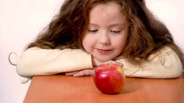 Girl Years Old Long Hair Happily Eats Apple Studio White — Stok video