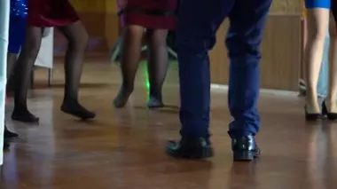 Dancing legs of men and women in the hall. Legs of dancing people at the party.