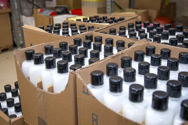 Cosmetic spray packaging at a store warehouse. Wholesale trade in lotions, cosmetics for hygiene.