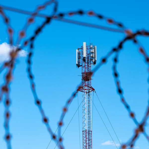 Telecommunication ban concept. Cellular communications are entangled with barbed wire.