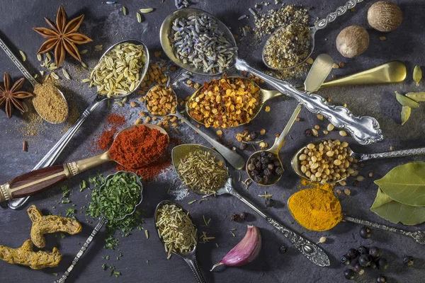 Spices on spoons - used to add flavor to cooking — Stockfoto