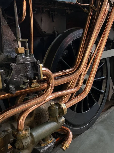 Copper pipework on a vintage steam locomotive — 스톡 사진