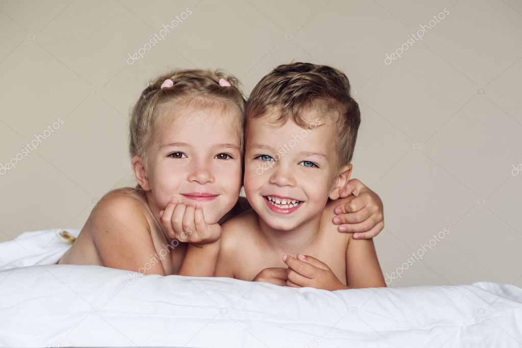 happy little sister hugging her brother 
