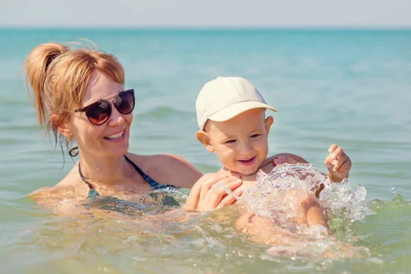 Happy mother playing with her little son — Stock Photo, Image