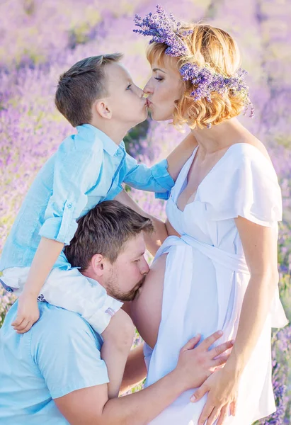 Happy young family  in a lavender field — Stock Photo, Image