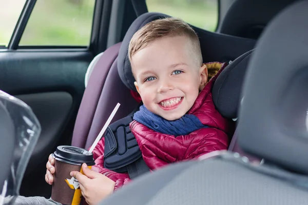 Adorable toddler boy in safety car seat — Stock Photo, Image
