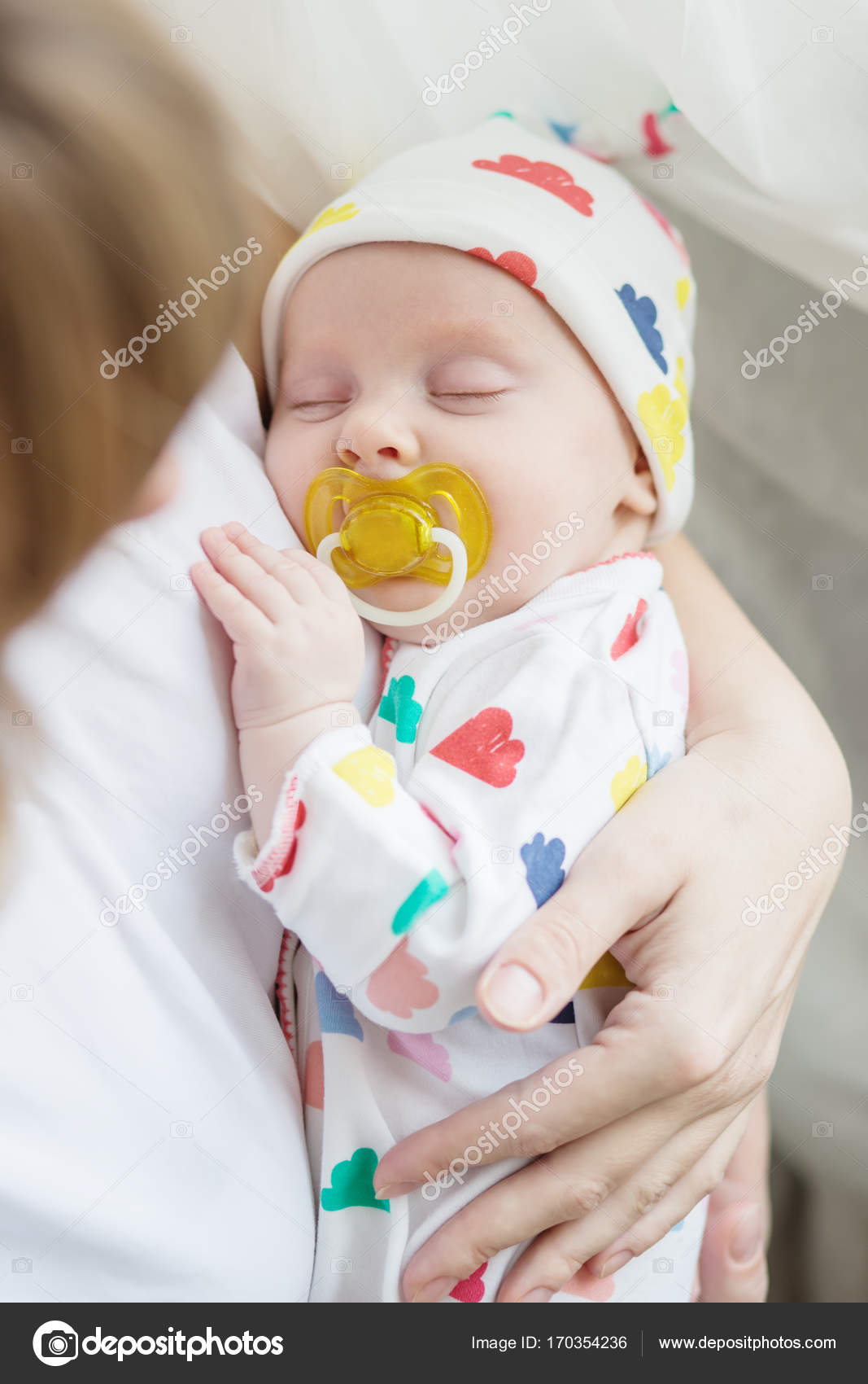 baby sleeping with pacifier
