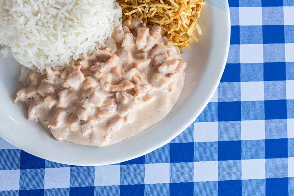 Plate of Rice, Beef stroganoff, Potatoes and Tomato Salad - Braz — Stock Photo, Image