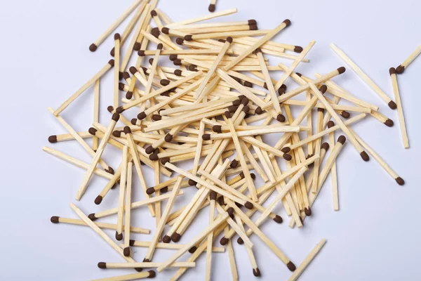 Matches on a white isolated background. Matches on a wooden background. Matches.