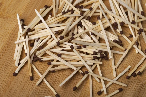 Matches on a white isolated background. Matches on a wooden background. Matches.