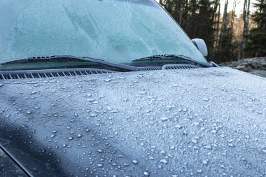 Suv / car with icy windows in winter