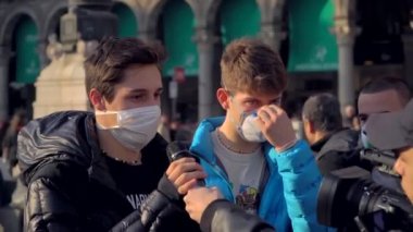 Milan Italy March 3, 2020: people in protective masks. Panic from the Chinese viral corona Covid 19 in Italy. People in the Duomo square and city streets. Quarantine in Milan. Epidemic. Panic MFW.