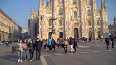 Milan Italy March 3, 2020: people in protective masks. Panic from the Chinese viral corona Covid 19 in Italy. People in the Duomo square and city streets. Quarantine in Milan. Epidemic. Panic MFW. 