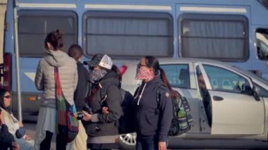 Milan Italy March 3, 2020: people in protective masks. Panic from the Chinese viral corona Covid 19 in Italy. People in the Duomo square and city streets. Quarantine in Milan. Epidemic. Panic MFW. 