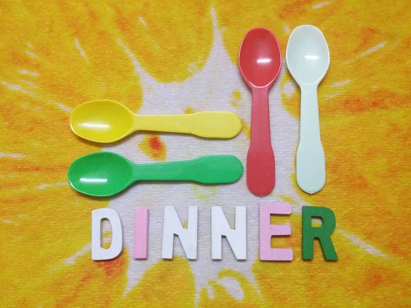 Colorful spoons and alphabets — Stock Photo, Image