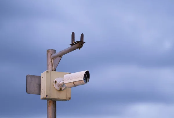 Old cctv with blue sky background — Stock Photo, Image