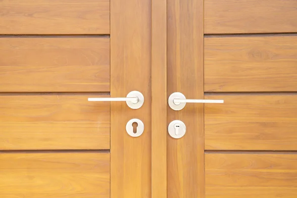 Door handle on modern wooden door